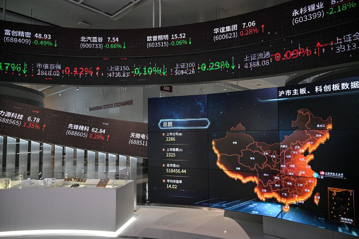 This photo shows a general view of screens diplaying financial