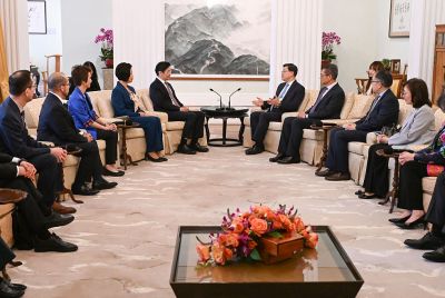 Hong Kong Chief Executive John Lee, centre right, with Singapore