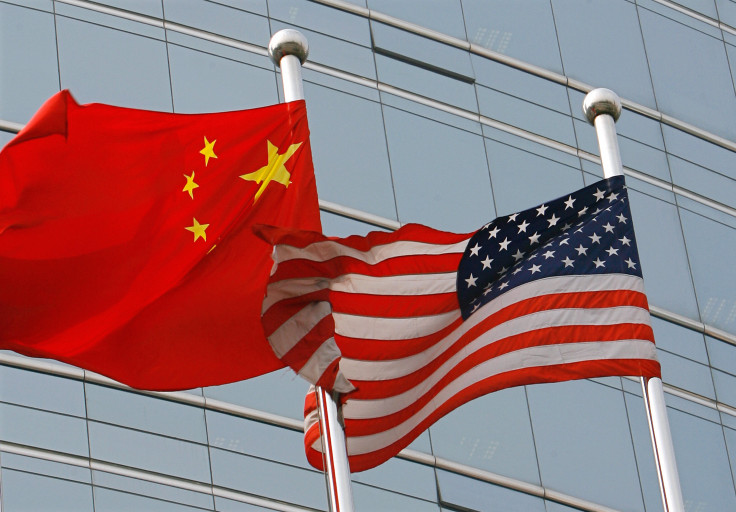 A US and a Chinese flag wave outside a commercial