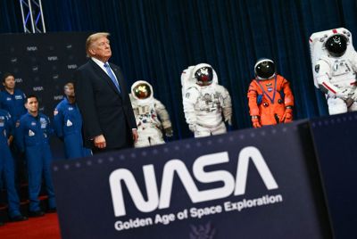 Astronauts and spacesuits from various NASA missions are seen as