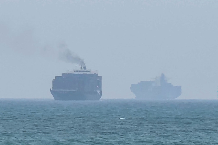 cargo ships anchoring near the Strait of Hormuz