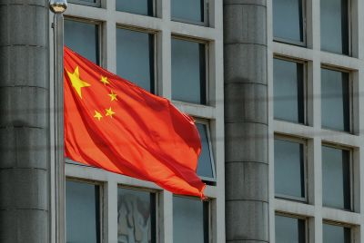 The Chinese national flag is seen on a flagpole in