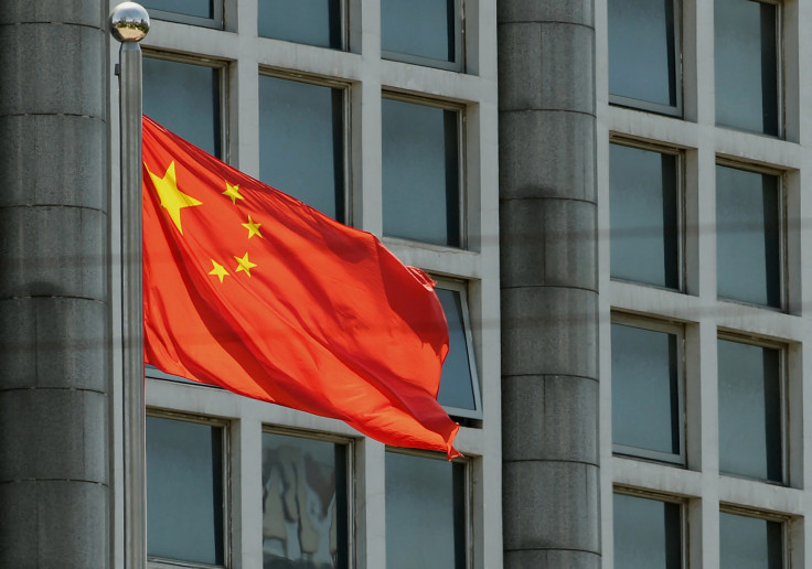 The Chinese national flag is seen on a flagpole in