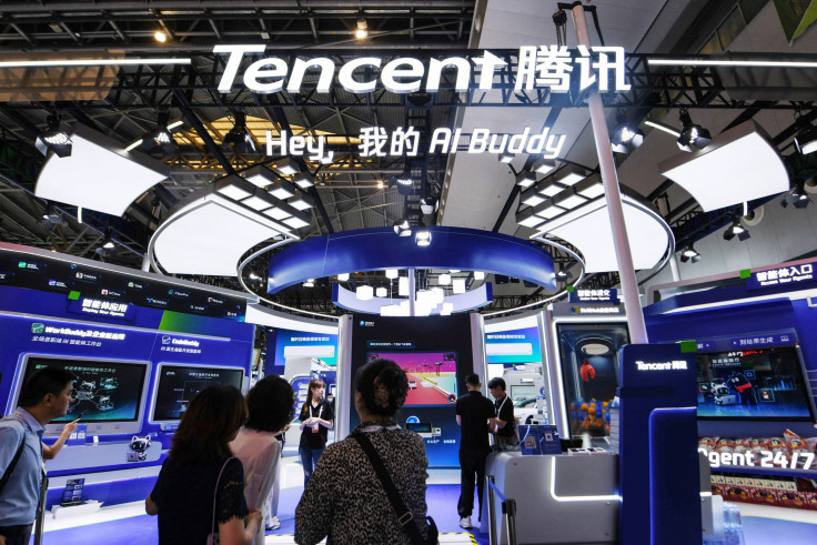 People visit the booth of Tencent during the World Artificial